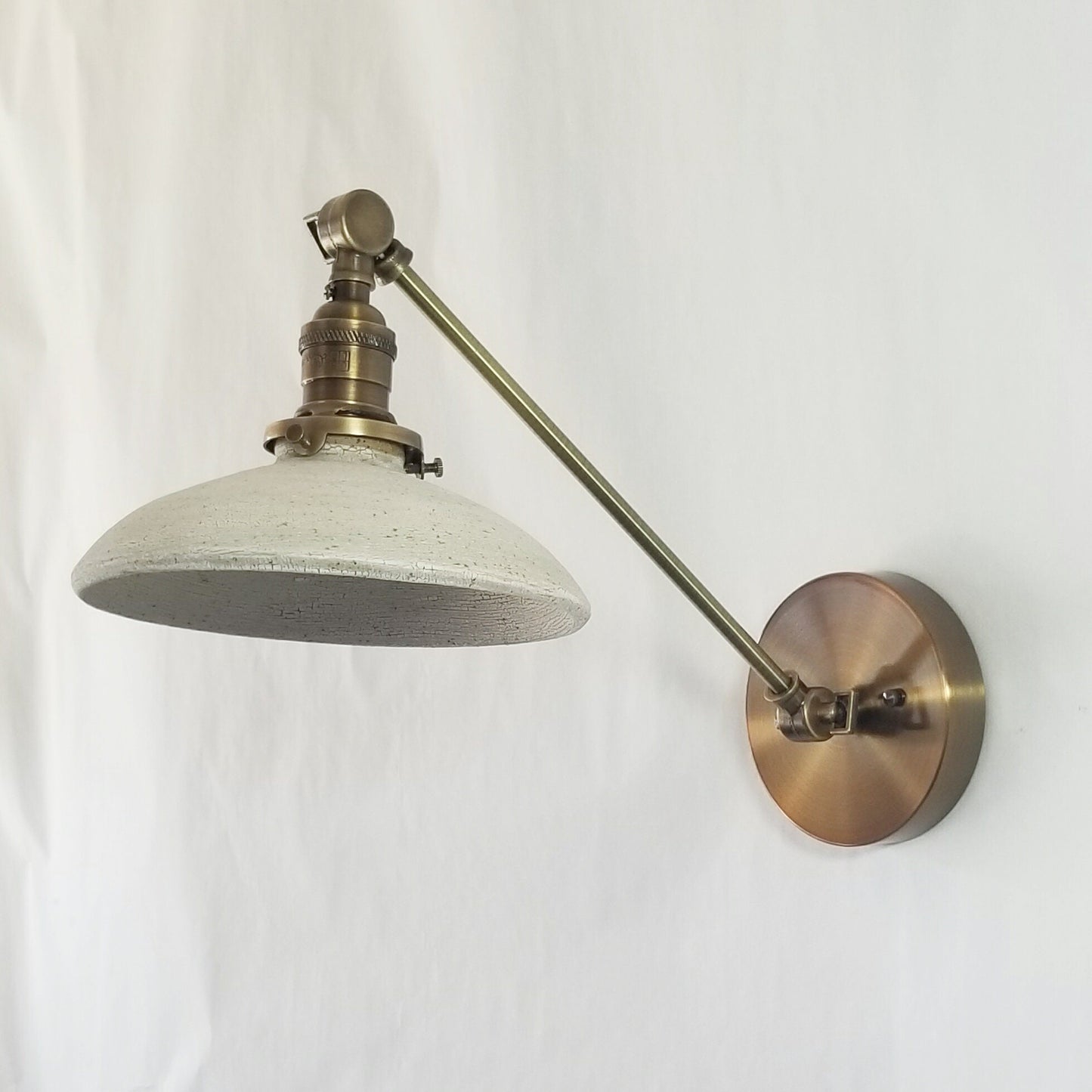 Style#103 Adjustable wall sconce available in a variety of sizes