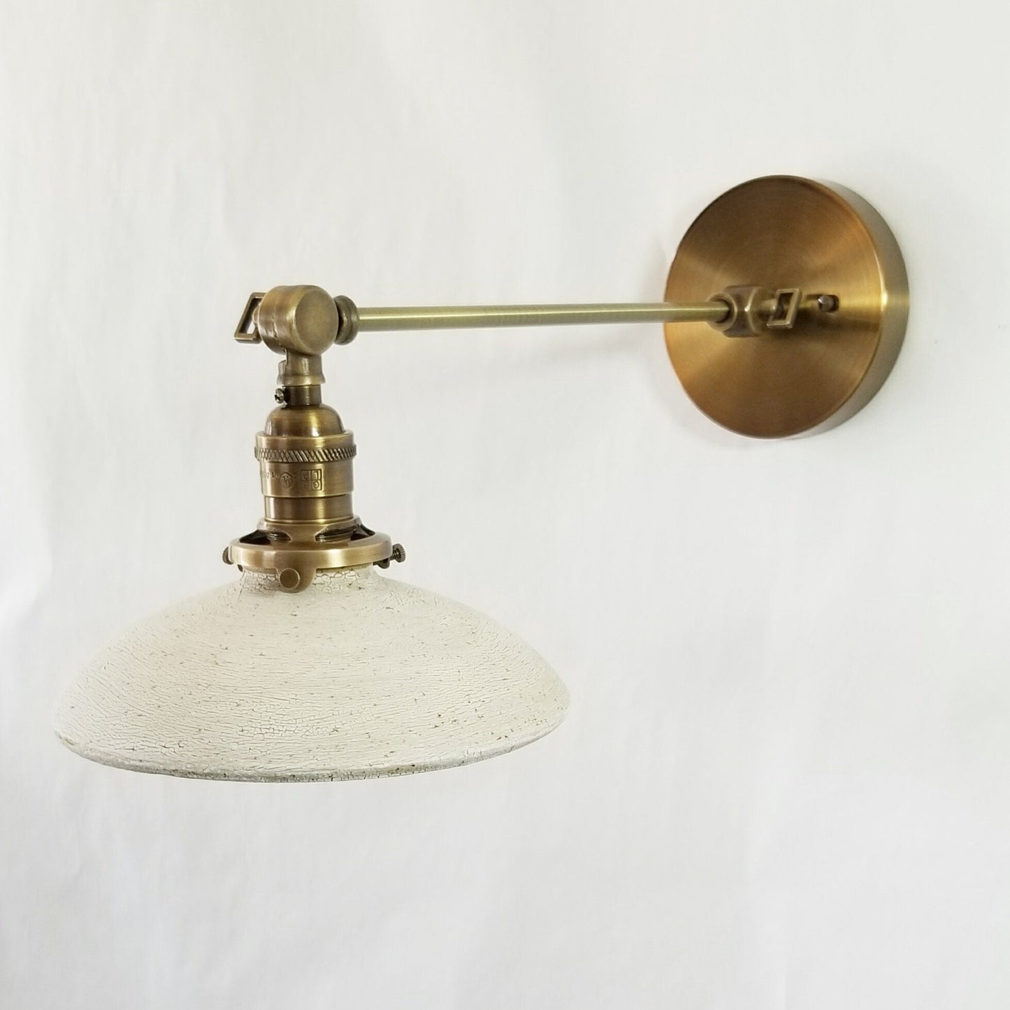 Style#103 Adjustable wall sconce available in a variety of sizes